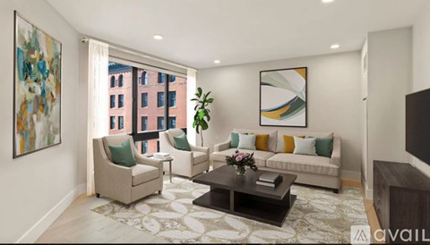 A living room with a large window, a sofa, a coffee table, and a painting on the wall.