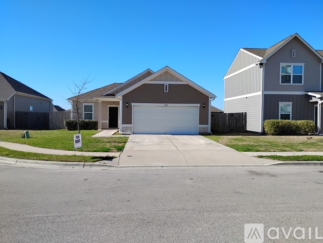 A house with a garage is available for sale.
