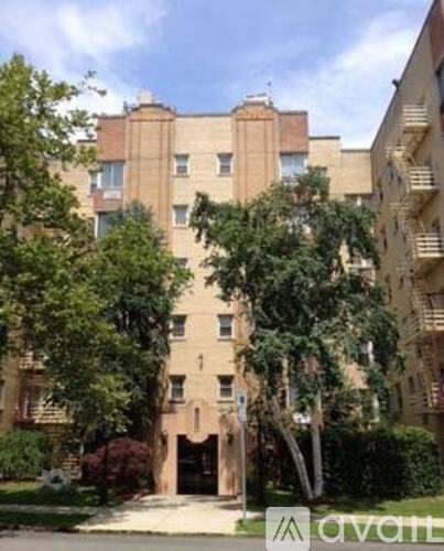 A large building with a tree in front of it.