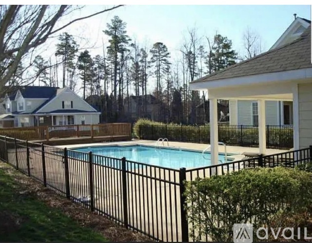 A house with a pool in the backyard.