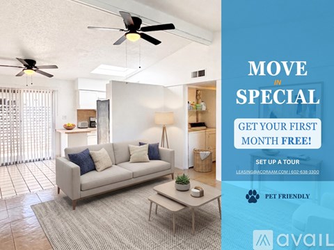 A living room with a couch, a fan, and a rug.