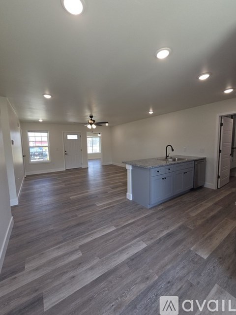 A kitchen area with a counter and cabinets.