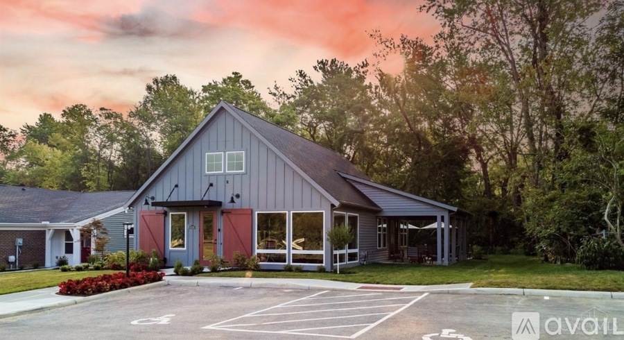 A building with a parking lot in front of it.