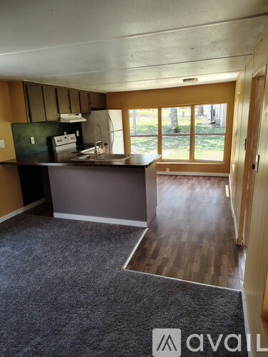 A kitchen with a counter and a window.