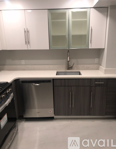 A kitchen with a dishwasher and a sink.