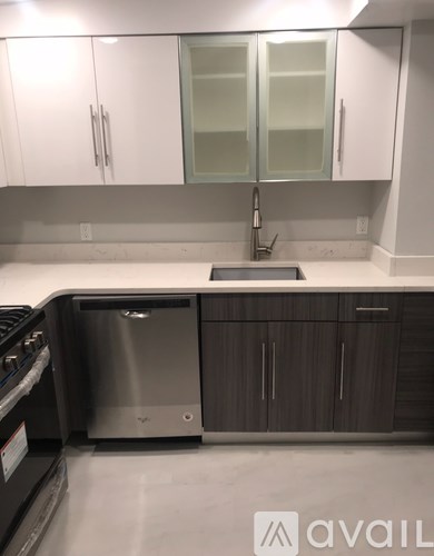 A kitchen with a dishwasher and a sink.