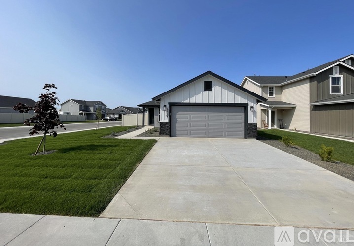A house with a garage is available for sale.