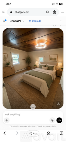 A bedroom with a bed, nightstand, and a window.
