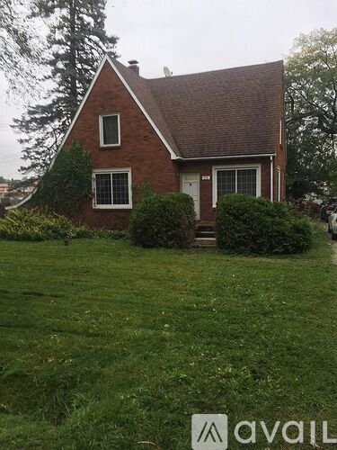 A house with a red brick exterior and a white door.