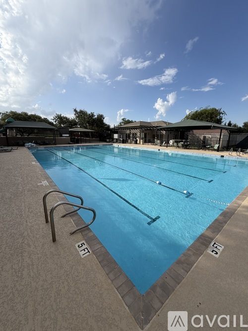 A large swimming pool with the numbers 5 and 50 marked on the side.