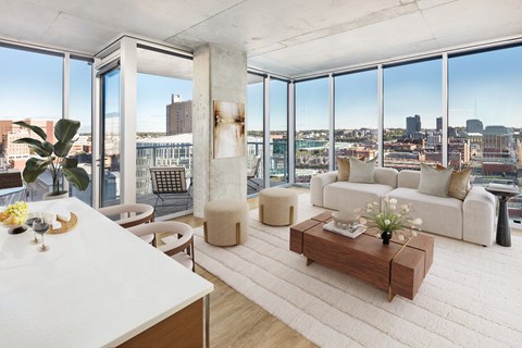 A modern living room with a view of the city.