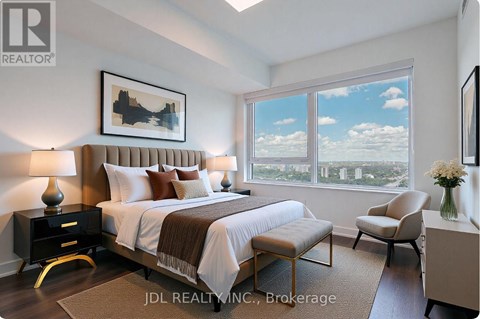 A bedroom with a large bed, a chair, and a painting on the wall.