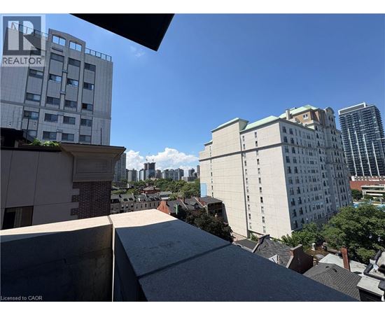 A cityscape with buildings and a clear sky.