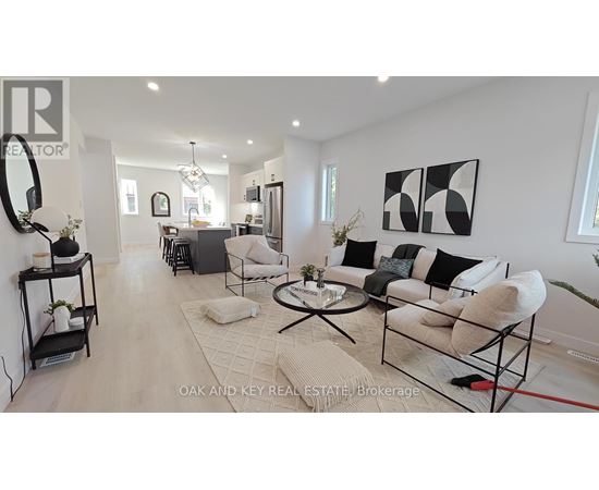 A living room with a white couch and a coffee table.
