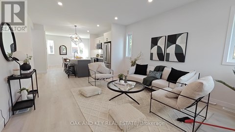 A living room with a white couch and a coffee table.