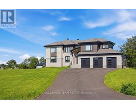 A large house with a driveway in front of it.
