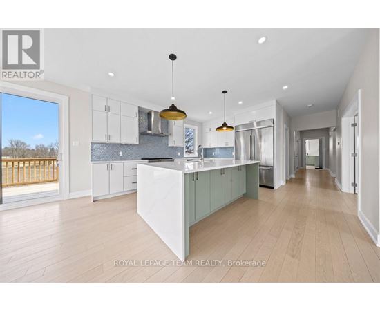 A spacious kitchen with a large island in the middle.