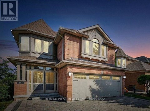 A house with a garage is for sale.