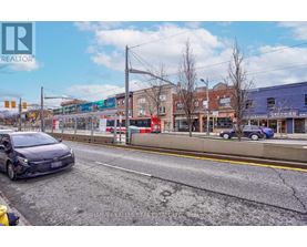 A street view with a car parked on the side of the road.
