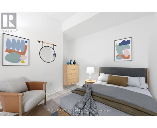 A bedroom with a bed, a chair, and a nightstand.