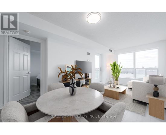 A modern living room with a dining table and chairs.