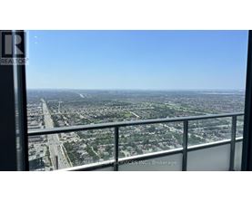 A view from a high-rise building looking out over a cityscape.