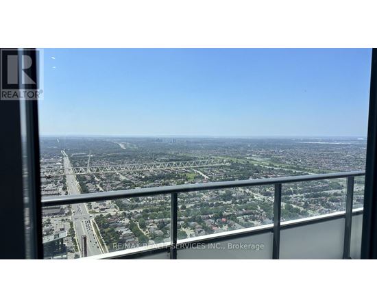 A view from a high-rise building looking out over a cityscape.