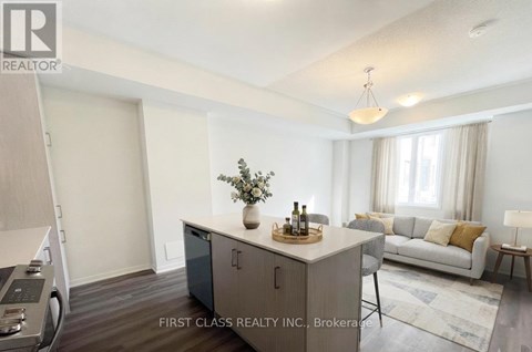 A modern living room with a grey cabinet and a grey sofa.