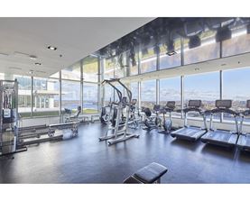 A gym with a view of the city.