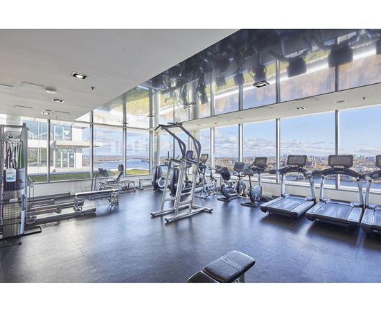 A gym with a view of the city.