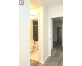 A bathroom with a toilet and a shower.