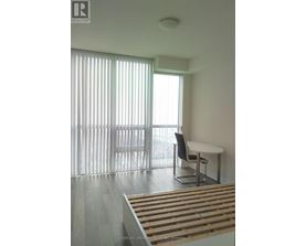 A room with a table and a chair is shown.