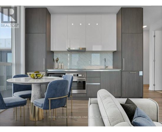 A modern kitchen with a dining table and chairs.