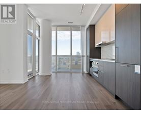A modern kitchen with a view of the city.