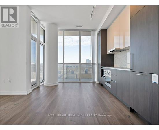 A modern kitchen with a view of the city.