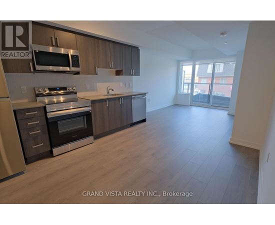 A kitchen with wooden cabinets and stainless steel appliances.