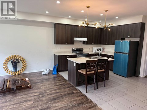 A kitchen with a white counter top and brown cabinets.