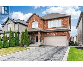 A large house with a garage is for sale.