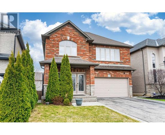 A house with a red brick exterior and a white garage door.