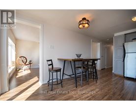 A dining area with a table and chairs is shown in the image.