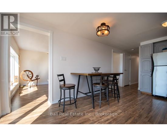 A dining area with a table and chairs is shown in the image.