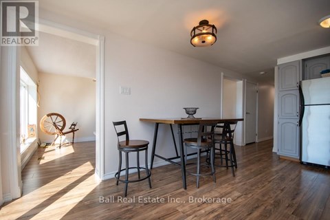 A dining area with a table and chairs is shown in the image.