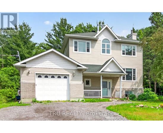 A two-story house with a garage is for sale.