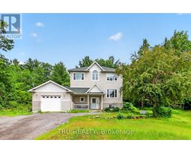 A house with a garage is for sale by Tru Realty Brokerage.