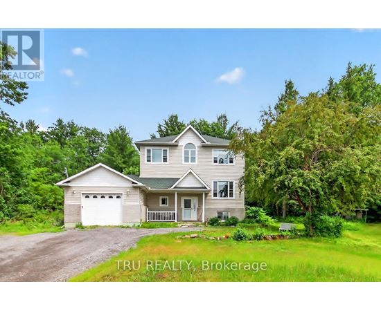 A house with a garage is for sale by Tru Realty Brokerage.