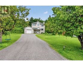 A house with a driveway in front of it.