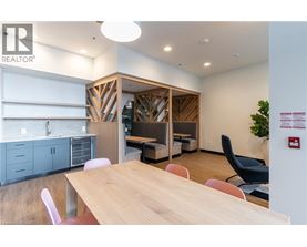 A conference room with a wooden table and chairs.