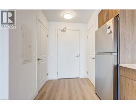 A white door is in the middle of a hallway.