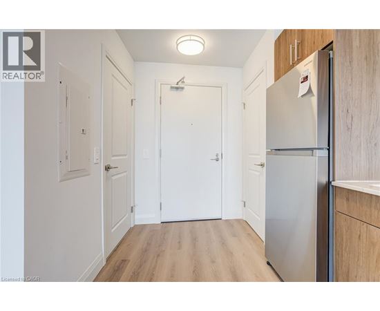 A white door is in the middle of a hallway.