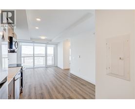 A realtor's image of a kitchen and living room.